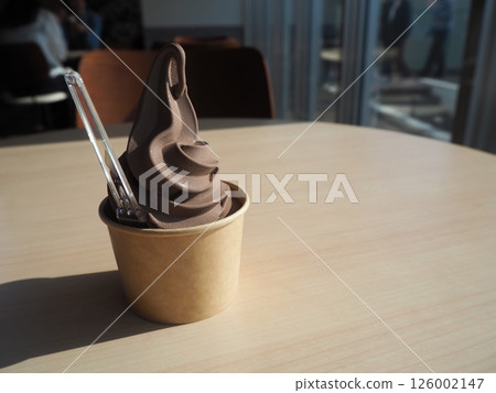Delicious chocolate flavoured soft serve ice cream 126002147
