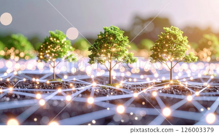 Close-up of miniature model trees on a technological grid representing sustainable development and eco-friendly innovation with glowing lights and sunlight 126003379