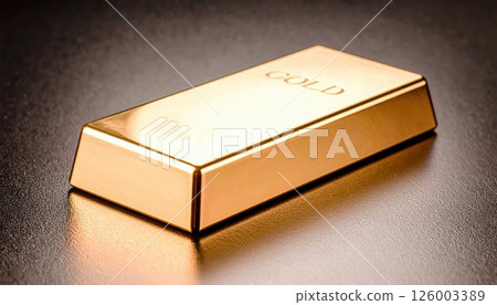 Close-up of a shiny gold bar with engraved markings resting on a smooth surface, highlighting precious metal investment and wealth symbol in a minimal setting Close-up of a shiny gold bar with engraved markings resting on a smooth surface, highlighting precious metal investment and wealth symbol in a minimal setting 126003389