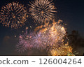 A spectacular fireworks display of gold and purple across the night sky A spectacular fireworks display of gold and purple across the night sky 126004264