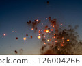 Art of sparks and smoke floating in the evening sky Art of sparks and smoke floating in the evening sky 126004266