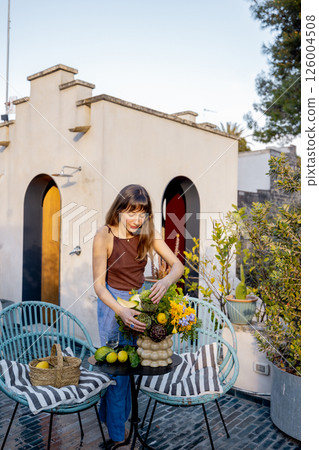 Terrace bouquet and rustic charm in Mediterranean rooftop garden 126004508