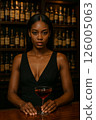 Woman drinking at a bar 126005063