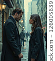 Urban romance encounter in foggy street - moody evening scene with architectural elegance and stylish attire 126005639