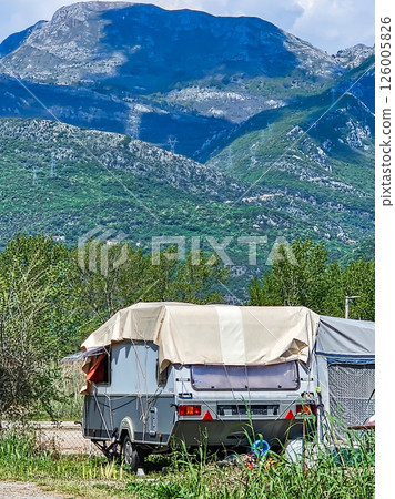 Camping Trailer with Clothes Drying Outside on a Clothesline 126005826