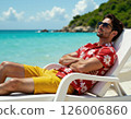 Tropical relaxation retreat: stylish beach fashion for men's summer getaway 126006860