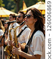 Vibrant jazz ensemble performing live outdoors at summer festival 126006869