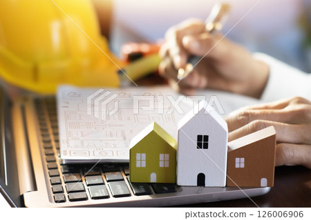 Engineers design construction. Engineers construct objects on site. Construction and design industry. 126006906