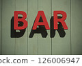 Closeup of bar signage on the wall in the street 126006947