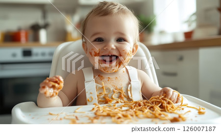 A delighted baby sitting in a highchair, joyfully eating messy spaghetti, creating a playful scene A delighted baby sitting in a highchair, joyfully eating messy spaghetti, creating a playful scene 126007187