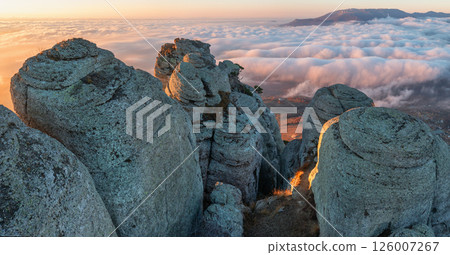View from the cliffs of Mount Demerdzhi to the cloud-covered area View from the cliffs of Mount Demerdzhi to the cloud-covered area 126007267