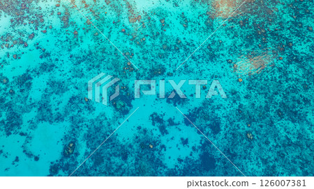 Aerial view of The coastline around the island is full of coral reefs. 126007381