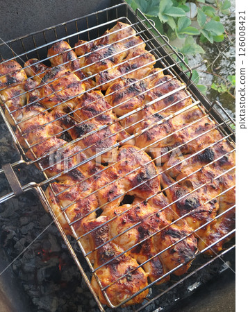beef steak grilling on charcoal grill. beef steak grilling on charcoal grill. 126008421