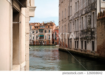 Picturesque view of a Venice canal taken from a bridge. Historic buildings with colorful facades 126008642