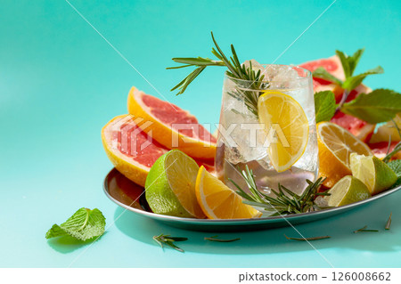 Refreshing summer drink with ice, citrus, rosemary and mint. 126008662