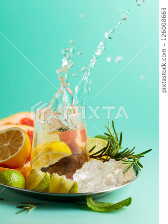 A refreshing summer drink with ice, citrus, rosemary and mint. A refreshing summer drink with ice, citrus, rosemary and mint. 126008663