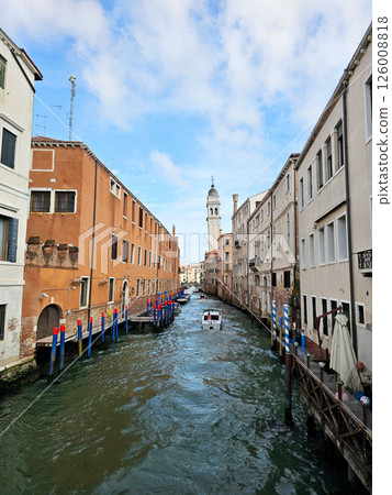 Picturesque view of a Venice canal taken from a bridge. Historic buildings with colorful facades 126008818