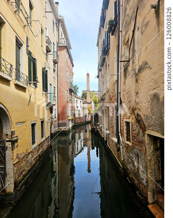 Picturesque view of a Venice canal taken from a bridge. Historic buildings with colorful facades 126008826