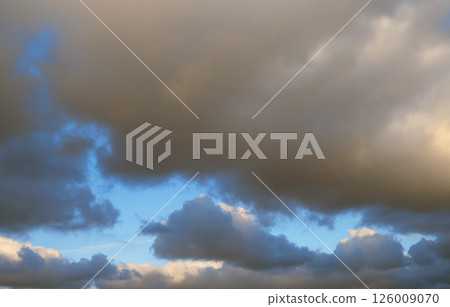 Beautiful bright sky with fluffy clouds. Natural clouds with blue sky background 126009070