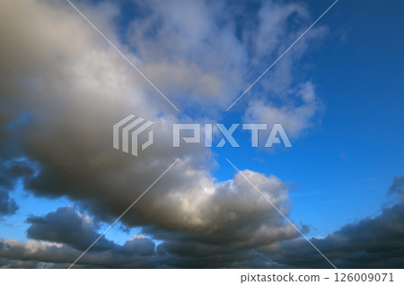 Beautiful bright sky with fluffy clouds. Natural clouds with blue sky background Beautiful bright sky with fluffy clouds. Natural clouds with blue sky background 126009071