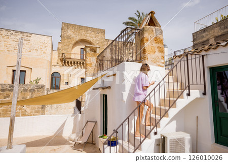 Sunlit steps and historic walls 126010026