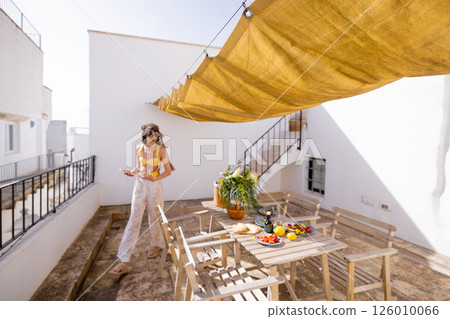 Rustic rooftop brunch under sunshade 126010066