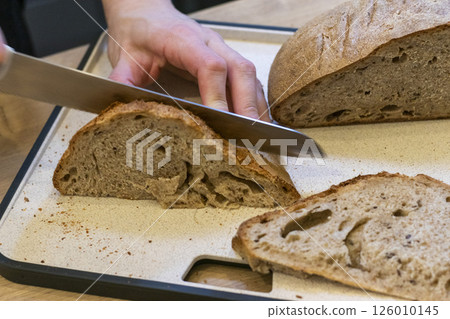 Cuts of freshly baked of home made rye bread 126010145