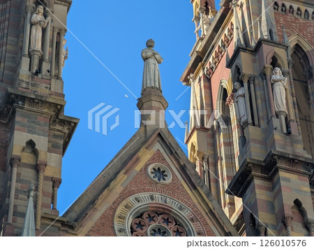 View of Church of the Sacred Heart of Jesus Capuchin Church in Cordoba, Argentina. Upper part. Sculptures 126010576