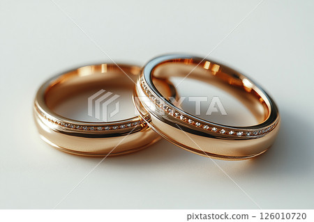 Pair of Wedding Rings on a white background. 126010720