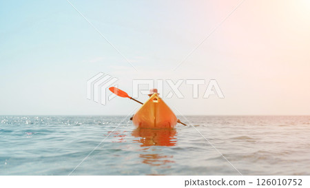 Kayak sea woman. Happy attractive woman with long hair in red swimsuit, swimming on kayak. Summer holiday vacation and travel concept. 126010752