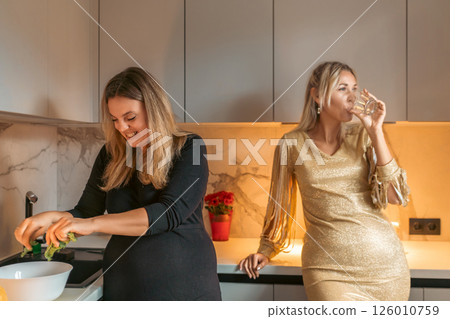 Women Cooking Kitchen Party Festive Friends Prepare Meal, Enjoy Drinks, Modern Apartment Women Cooking Kitchen Party Festive Friends Prepare Meal, Enjoy Drinks, Modern Apartment 126010759