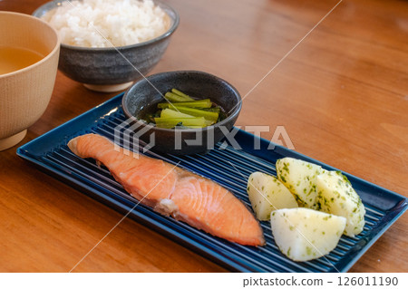 A simple Japanese breakfast of salmon and potatoes 126011190