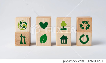 Wooden blocks display symbols representing sustainability, eco-friendliness, and renewable energy, emphasizing the importance of environmental awareness in daily life 126011211