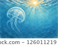Jellyfish floating in the ocean with sunlight visible 126011219