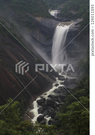 Waterfall shrouded in mist 126011893