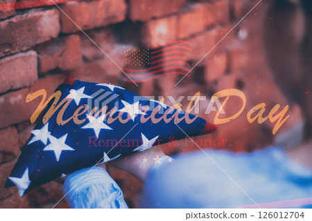 Woman holding folded american flag for Memorial Day tribute remember and honor veterans. Woman holding folded american flag for Memorial Day tribute remember and honor veterans. 126012704
