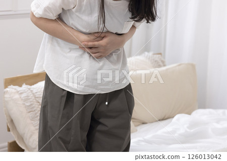 Middle-aged woman with stomach ache Middle-aged woman with stomach ache 126013042