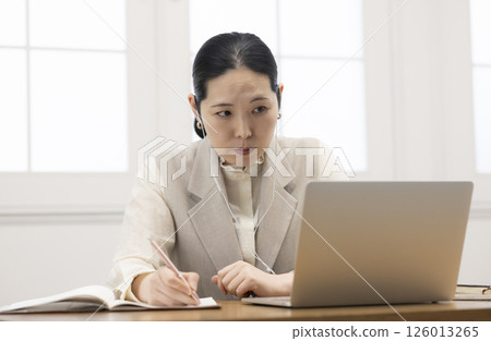 Women studying online Women studying online 126013265