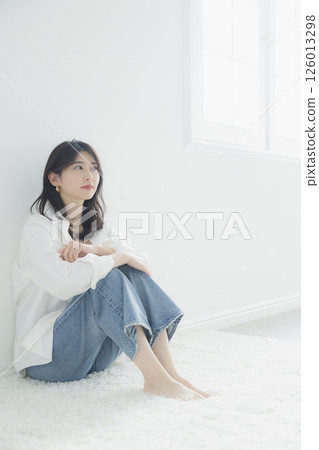 Young woman relaxing in the living room Young woman relaxing in the living room 126013298