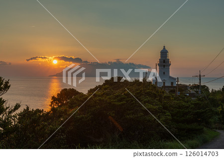 Evening view of Yakushima Lighthouse (January) Sunset over Kuchinoerabu Island and the lighthouse 126014703