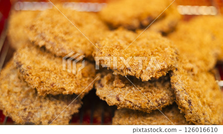 Freshly fried croquettes at a delicatessen 126016610