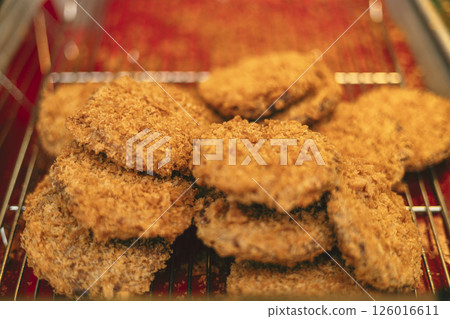 Freshly fried croquettes at a delicatessen 126016611