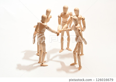 Image of people standing in a circle, stacking their hands to confirm unity. Image of people standing in a circle, stacking their hands to confirm unity. 126016679