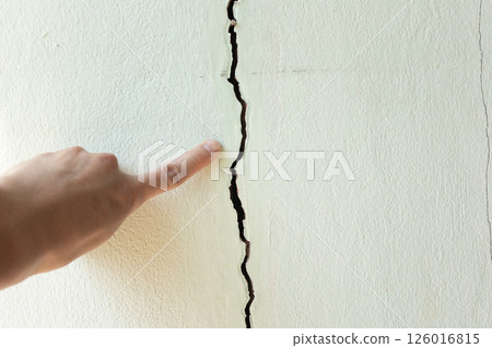 Crack or damage on concrete wall need repair. Crack or damage on concrete wall need repair. 126016815