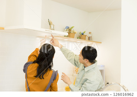 Male worker repairing the kitchen Male worker repairing the kitchen 126016962