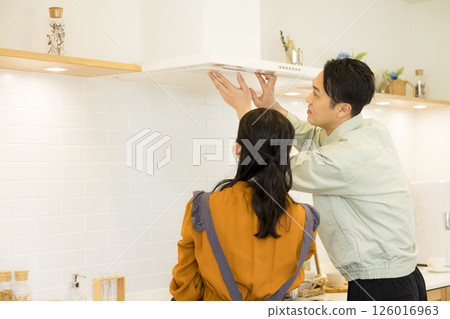 Male worker repairing the kitchen Male worker repairing the kitchen 126016963