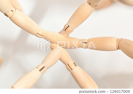 Image of people standing in a circle, stacking their hands to confirm unity. Image of people standing in a circle, stacking their hands to confirm unity. 126017009