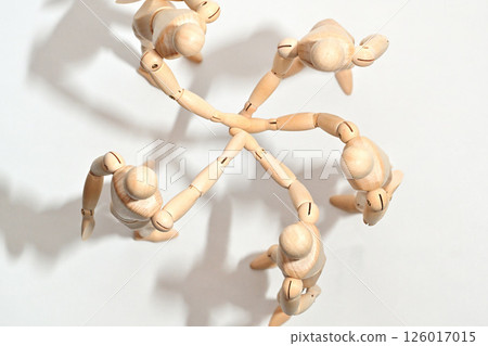 Image of people standing in a circle, stacking their hands to confirm unity. Image of people standing in a circle, stacking their hands to confirm unity. 126017015