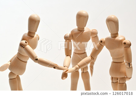Image of people standing in a circle, stacking their hands to confirm unity. Image of people standing in a circle, stacking their hands to confirm unity. 126017018