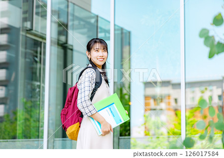 College student woman walking outside 126017584